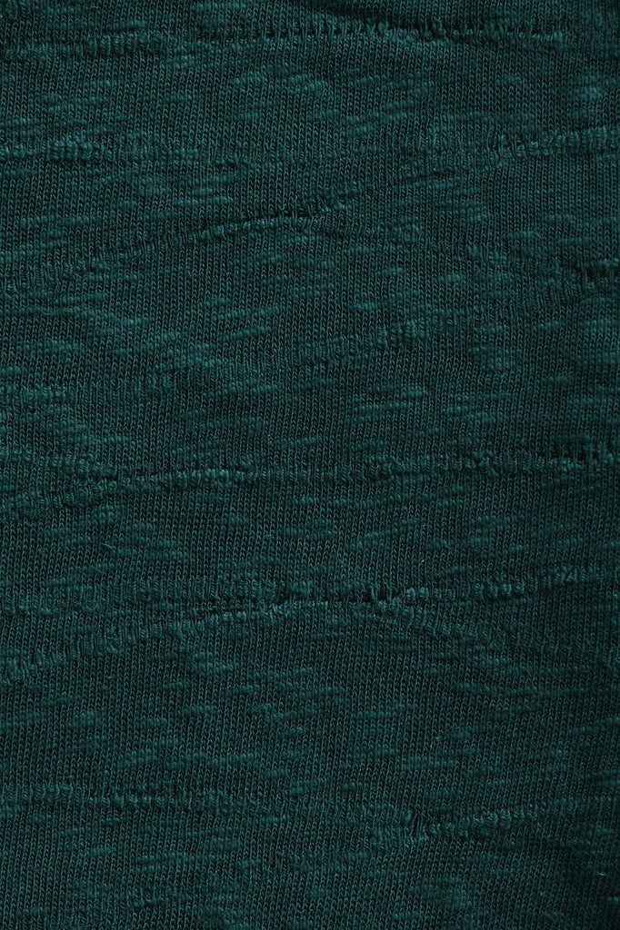 Closeup of sweater knit fabric made of organic cotton.