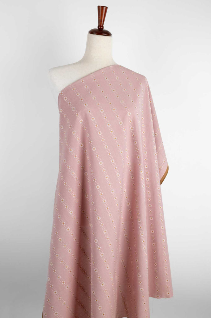 a pink and white dress on a mannequin