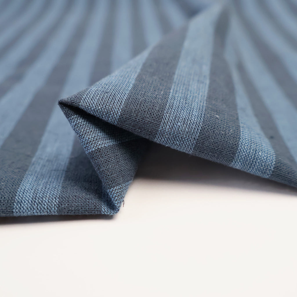 a close up of a blue and white striped fabric