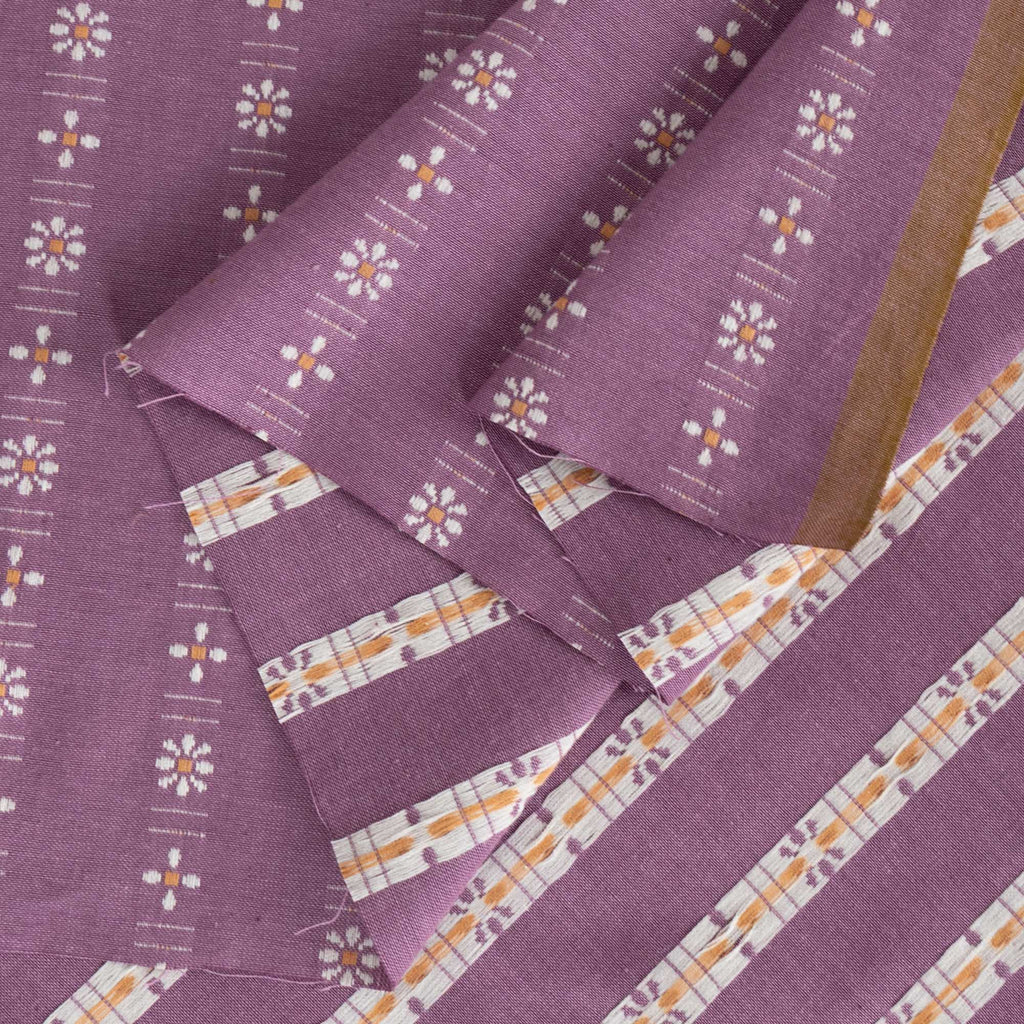 a close up of a purple cloth with flowers on it