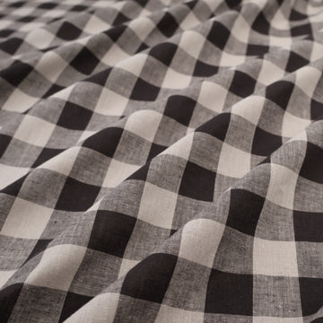 a close up of a black and white checkered fabric