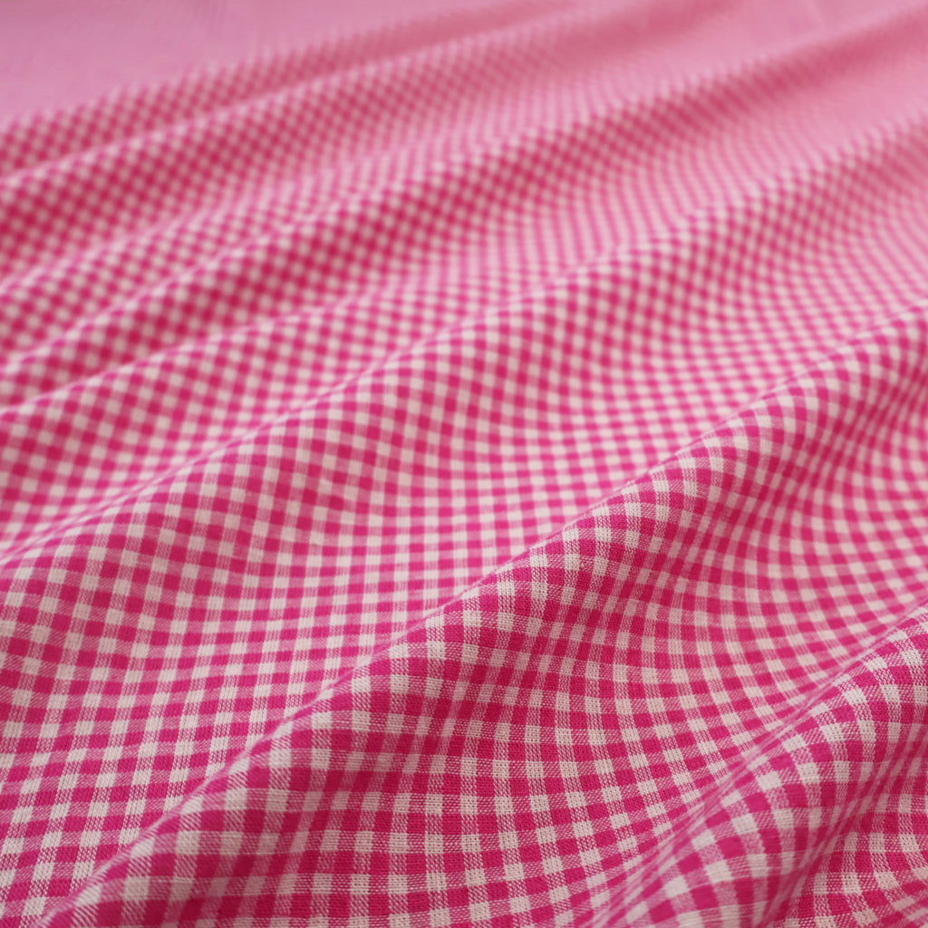 a pink and white checkered fabric