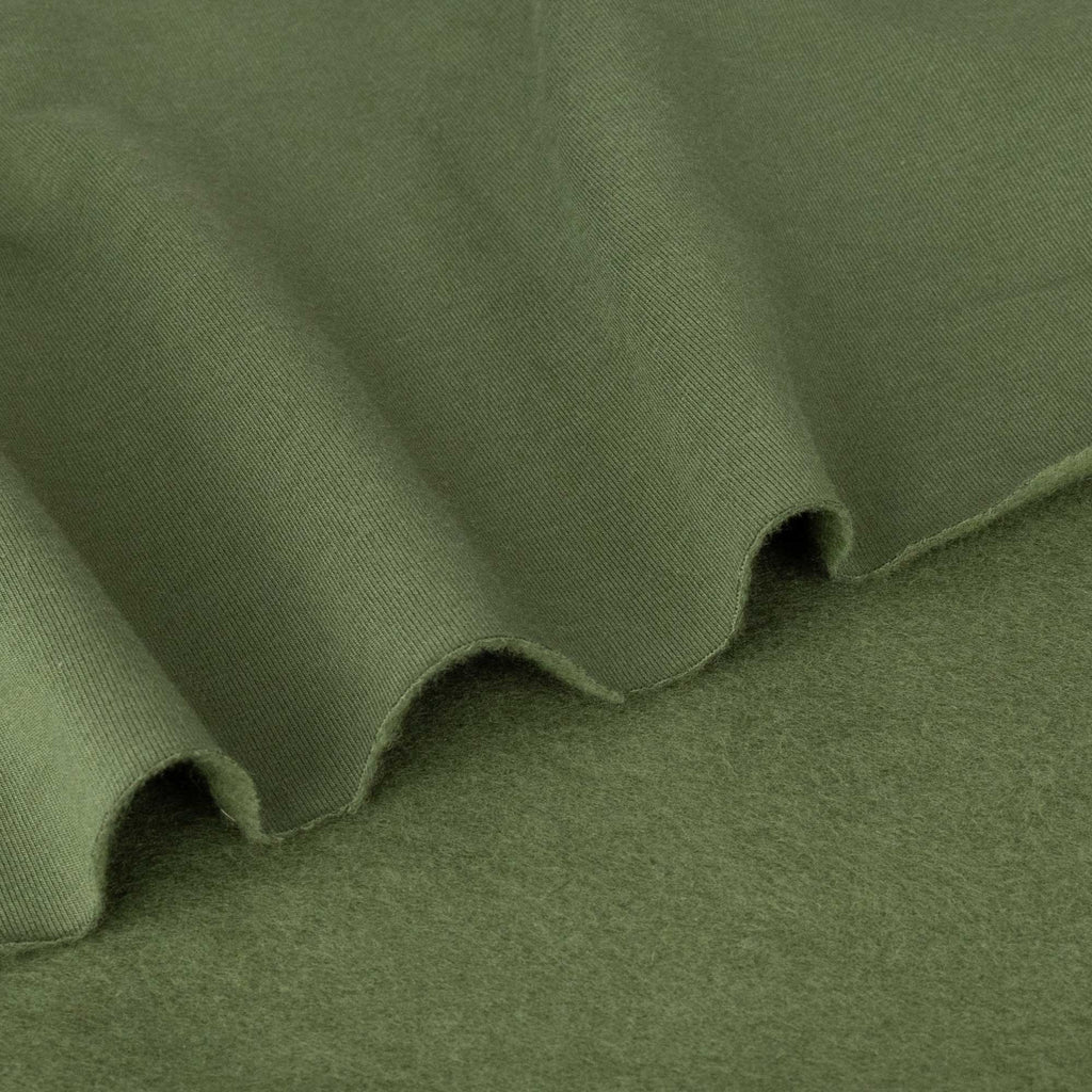 a close up view of a green fabric