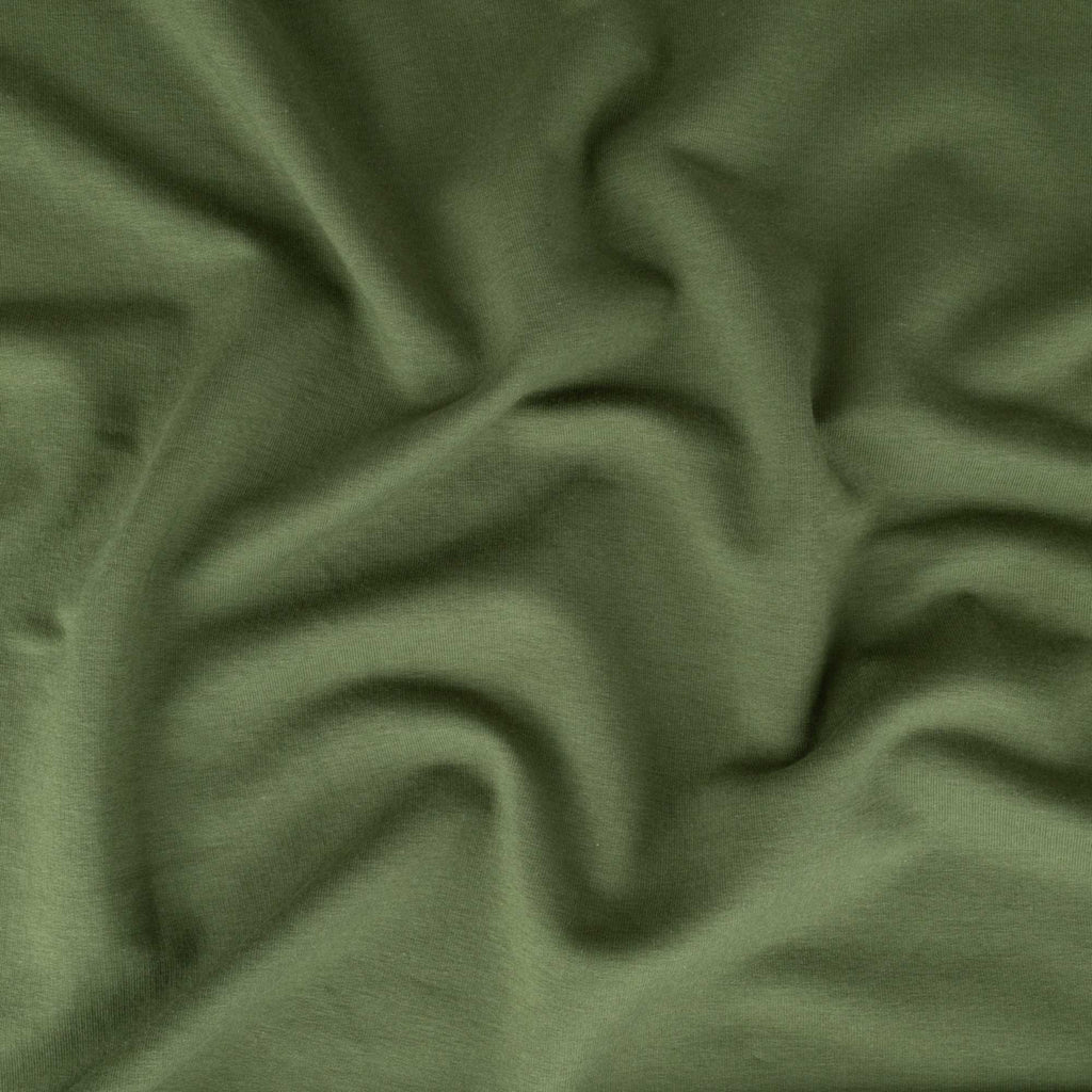 a close up view of a green fabric