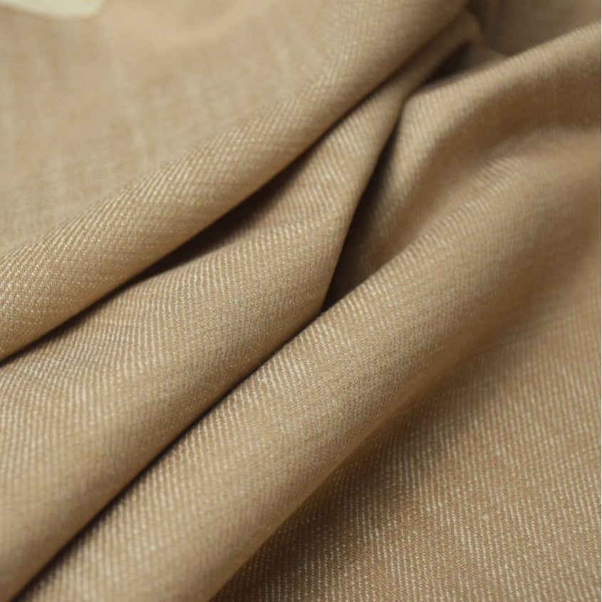 Close-up of beige fabric with folds