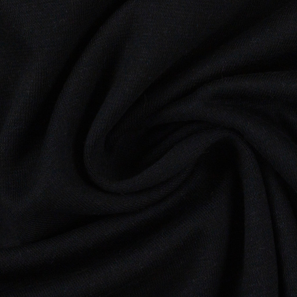 Closeup of black jersey knit fabric.