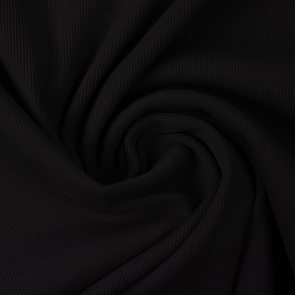 Black rib knit fabric gathered into a swirl.