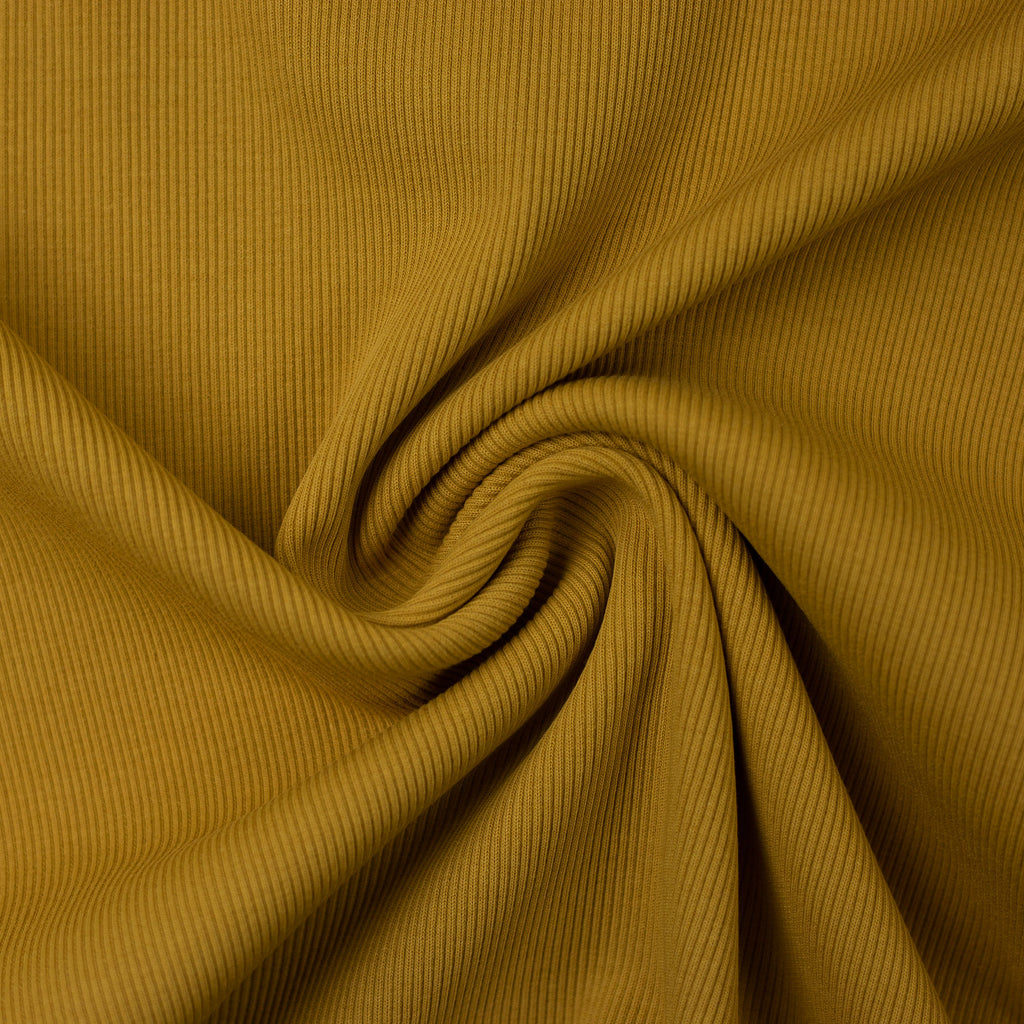 Mustard colored rib knit fabric gathered into a swirl.
