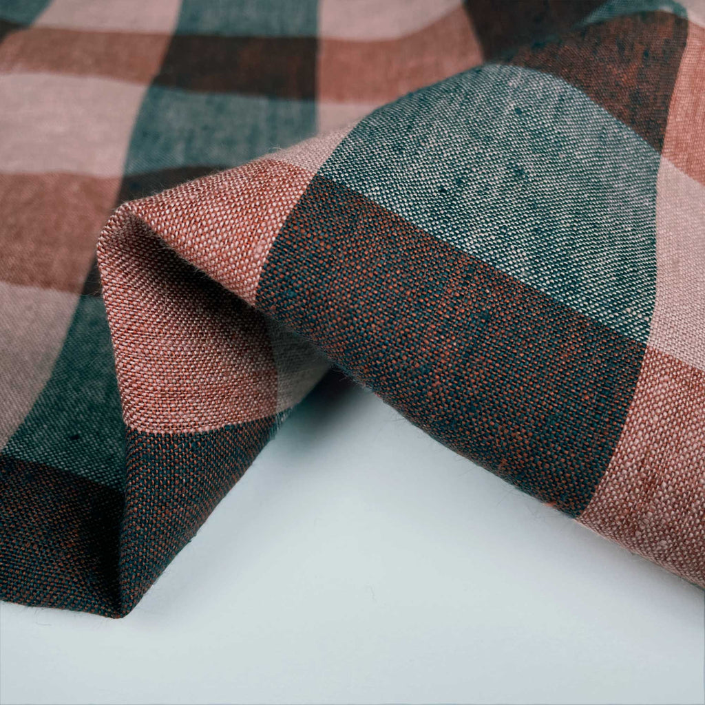 a close up of a tie on a white surface