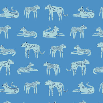 Art Gallery cotton jersey fabric closeup with tigers and cheetahs on a cornflower blue background.